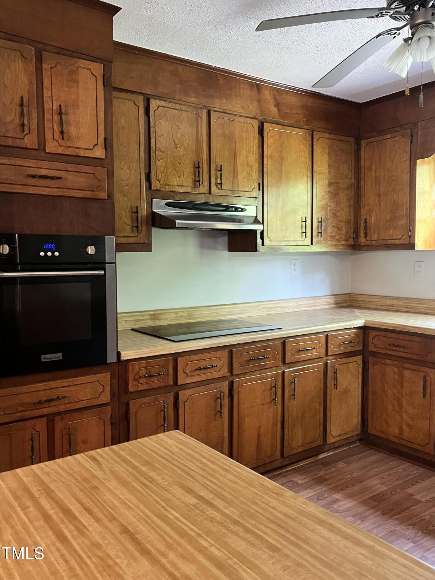 3226 Bunnlevel Erwin Road Erwin, NC 28339 - Photo 6 of 21 a kitchen with stainless steel appliances granite countertop a sink and cabinets