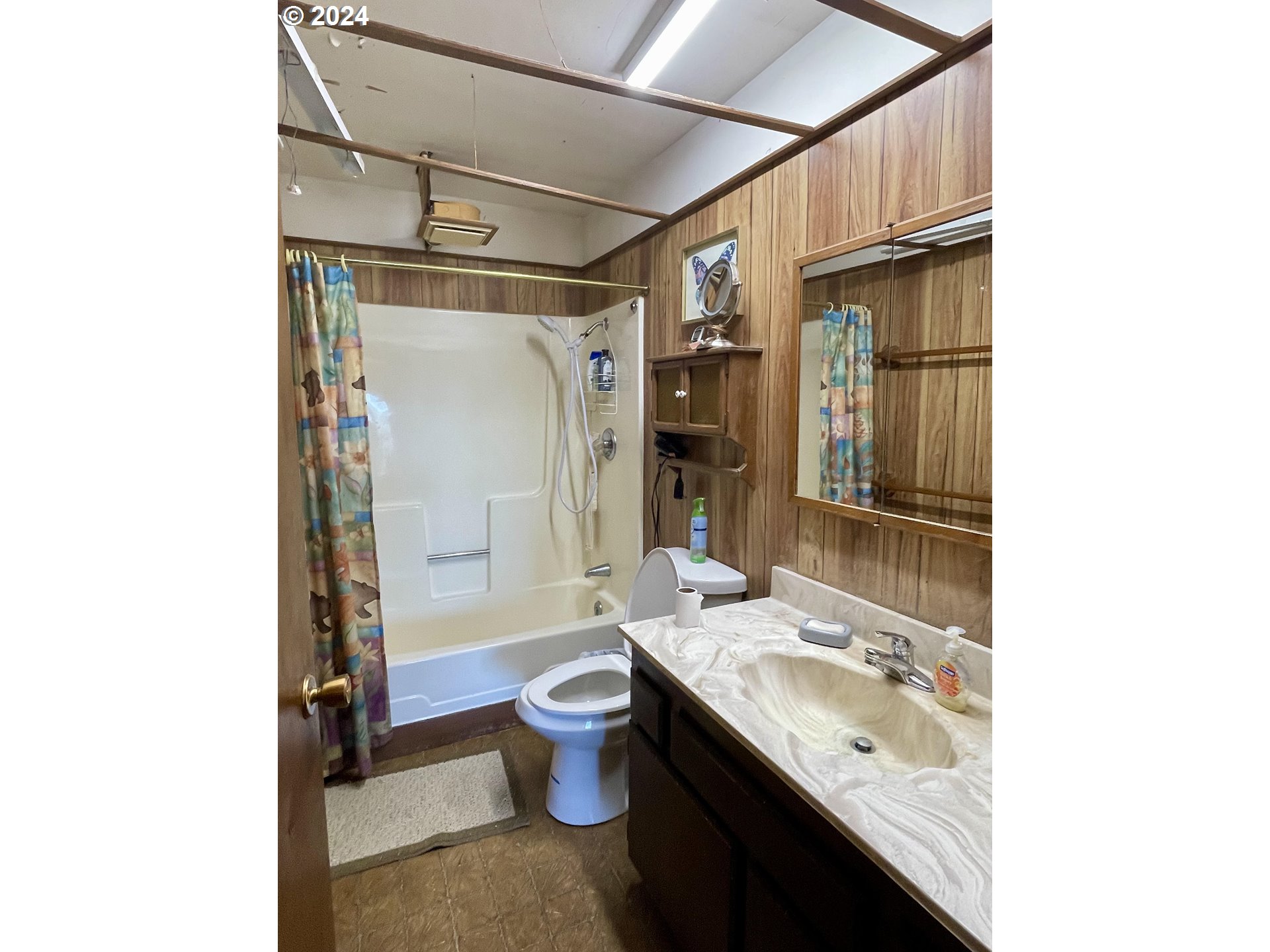 96333 Wildwood Road Brookings, OR 97415 - Photo 14 of 19 a bathroom with a granite countertop sink toilet and shower