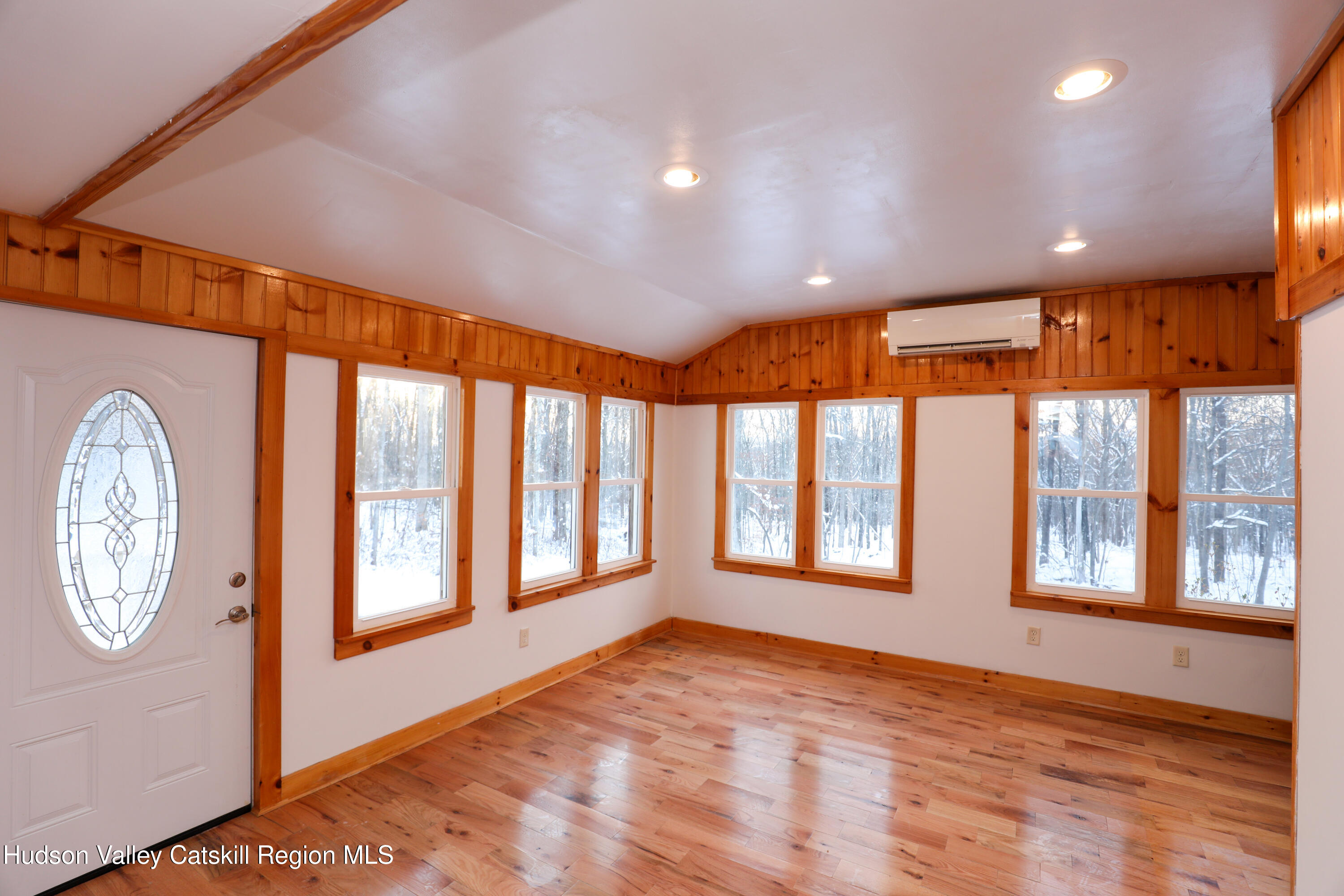 38 Roxanne Boulevard Highland, NY 12528 - Photo 11 of 42 a view of an empty room with a window and wooden floor