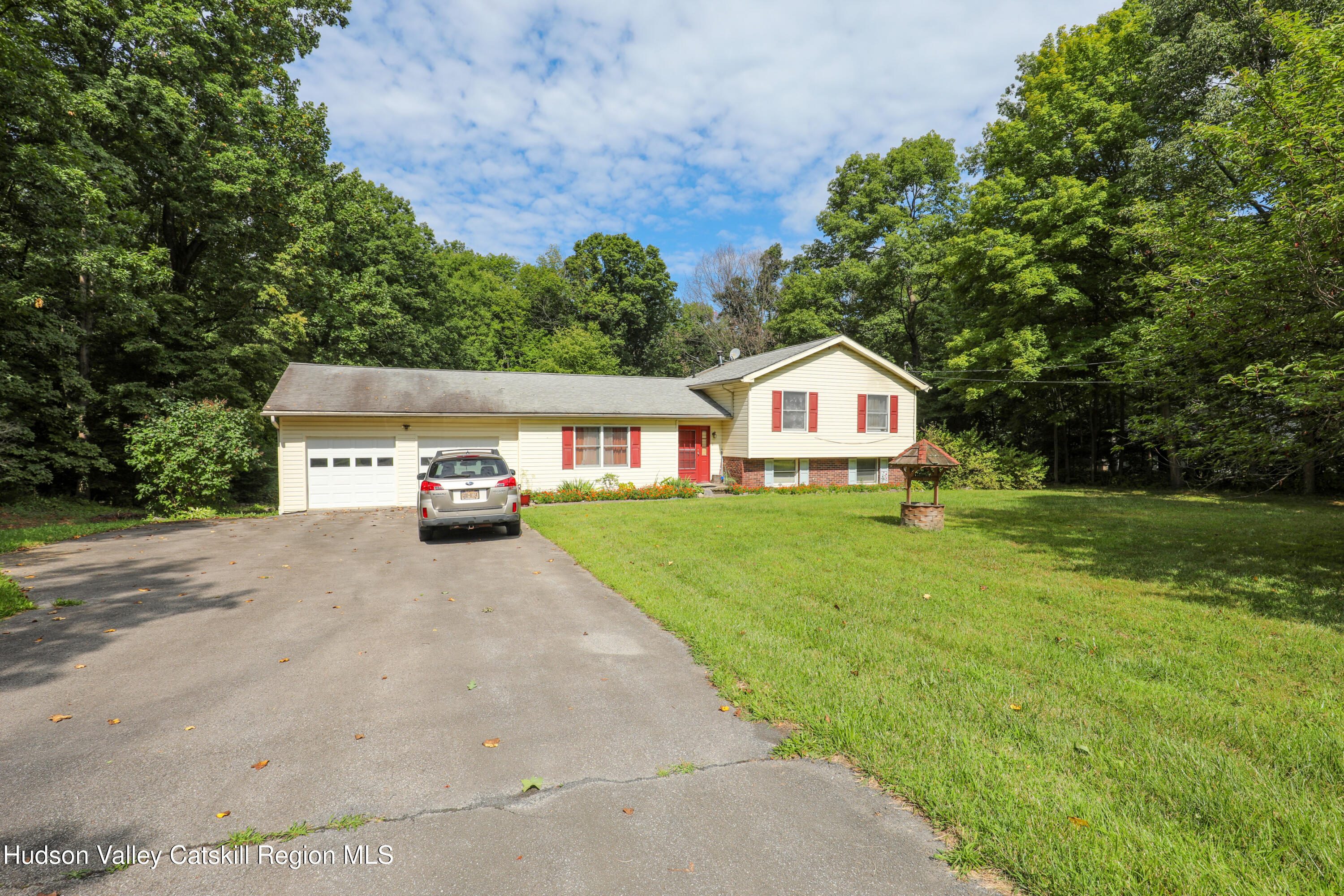 38 Roxanne Boulevard Highland, NY 12528 - Photo 2 of 42 a house view with a garden space