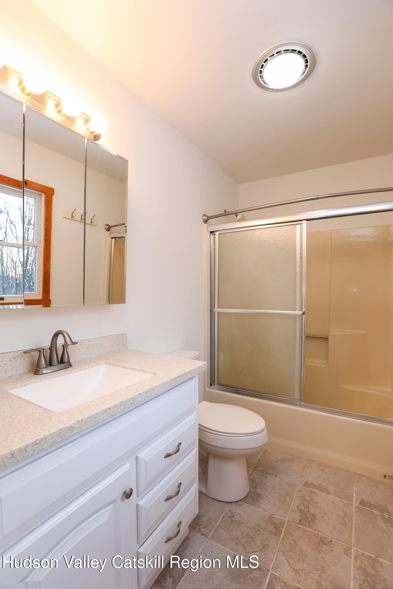 38 Roxanne Boulevard Highland, NY 12528 - Photo 25 of 42 a bathroom with a granite countertop sink toilet a mirror and shower