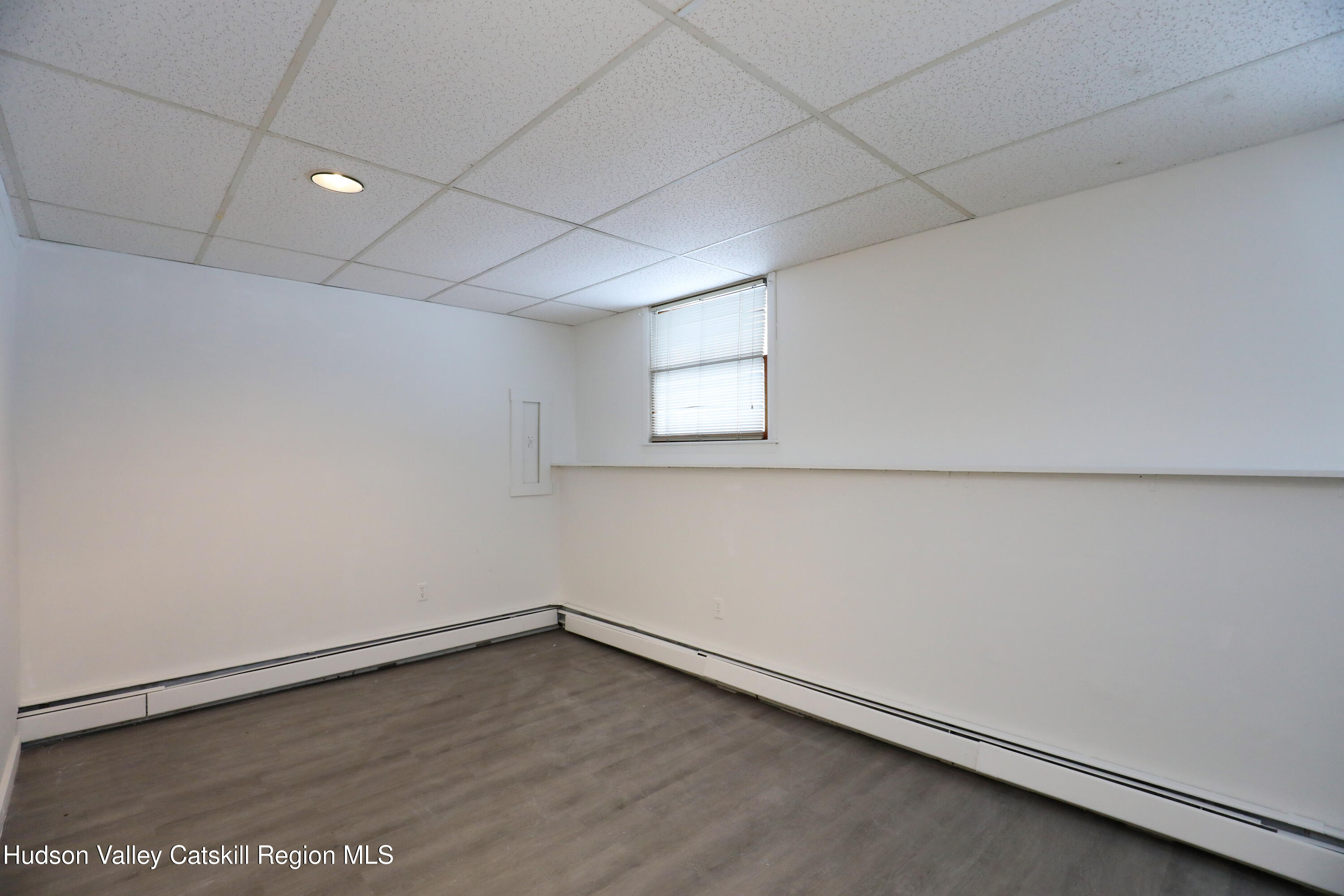 38 Roxanne Boulevard Highland, NY 12528 - Photo 34 of 42 an empty room with wooden floor and windows