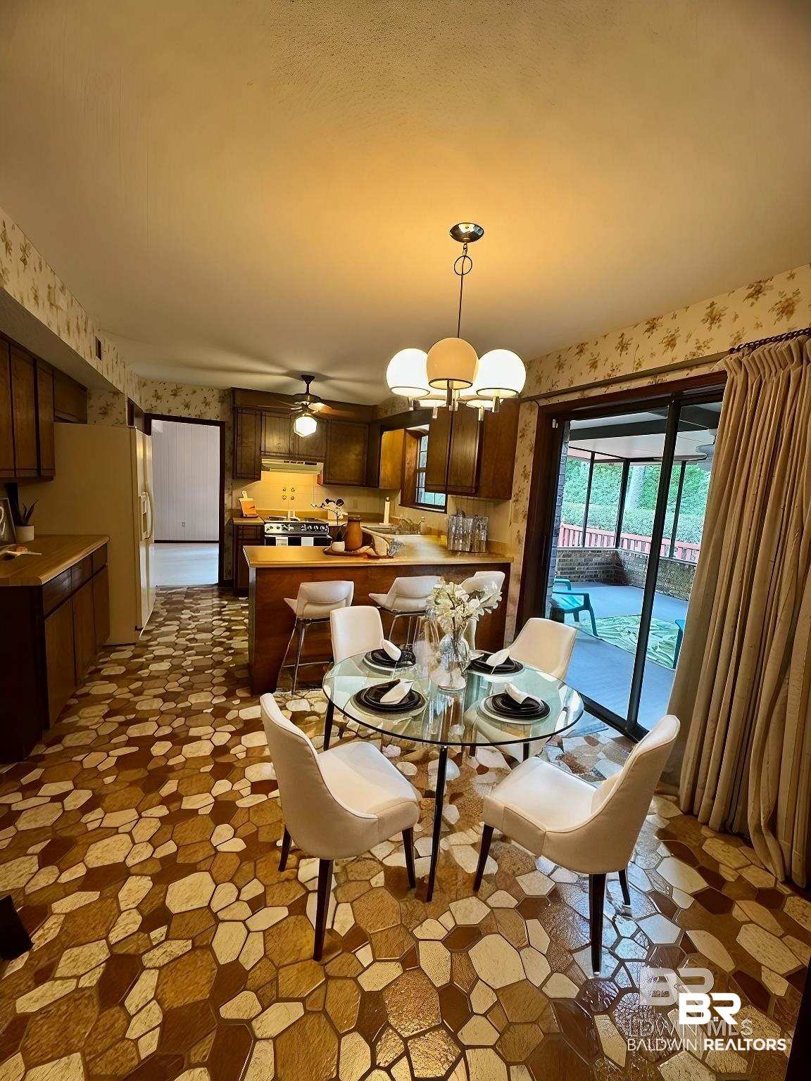 2240 Perdido Circle Lillian, AL 36549 - Photo 6 of 42 Dining room featuring ceiling fan with notable chandelier
