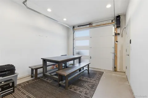a living room with furniture a wooden floor and a rug