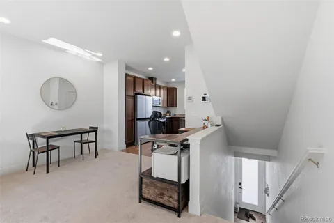 a kitchen with stainless steel appliances a refrigerator sink and cabinets