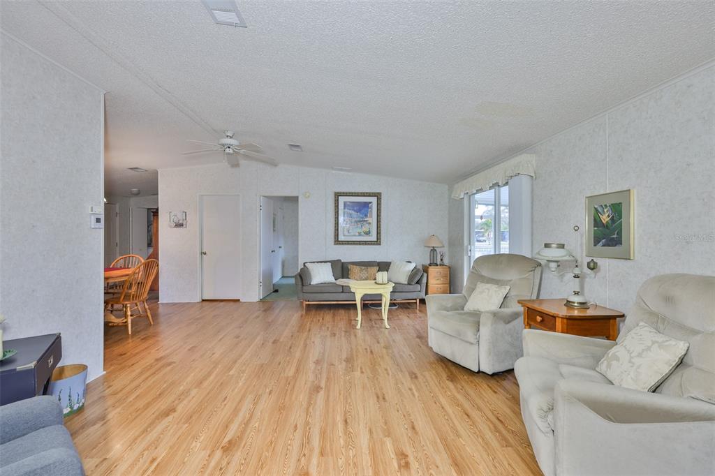 980 7th Street Northwest, Unit 16 Largo, FL 33770 - Photo 13 of 35 a living room with furniture and a wooden floor