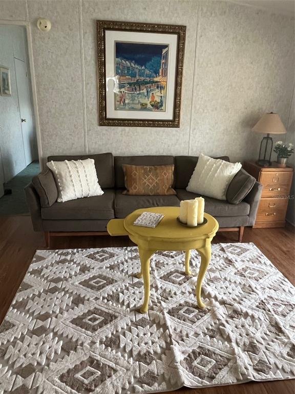 980 7th Street Northwest, Unit 16 Largo, FL 33770 - Photo 14 of 35 a living room with a couch