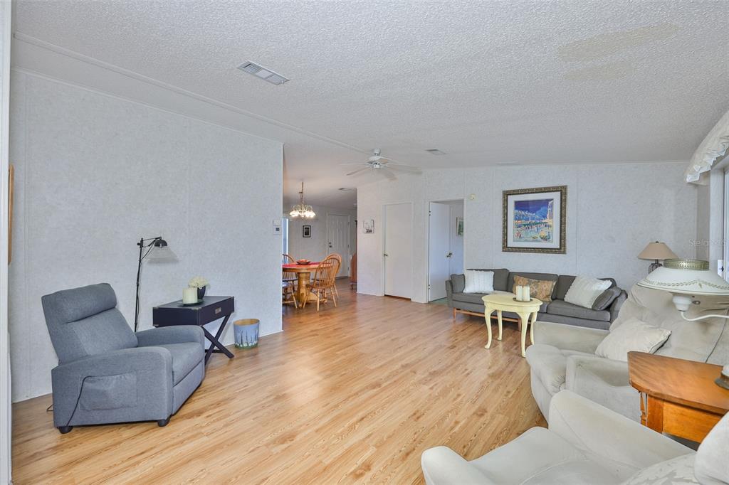 980 7th Street Northwest, Unit 16 Largo, FL 33770 - Photo 16 of 35 a living room with furniture and wooden floor