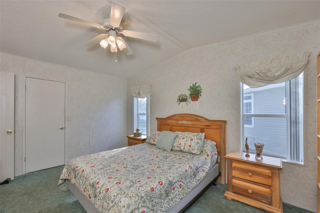 980 7th Street Northwest, Unit 16 Largo, FL 33770 - Photo 22 of 35 a bedroom with bed and window