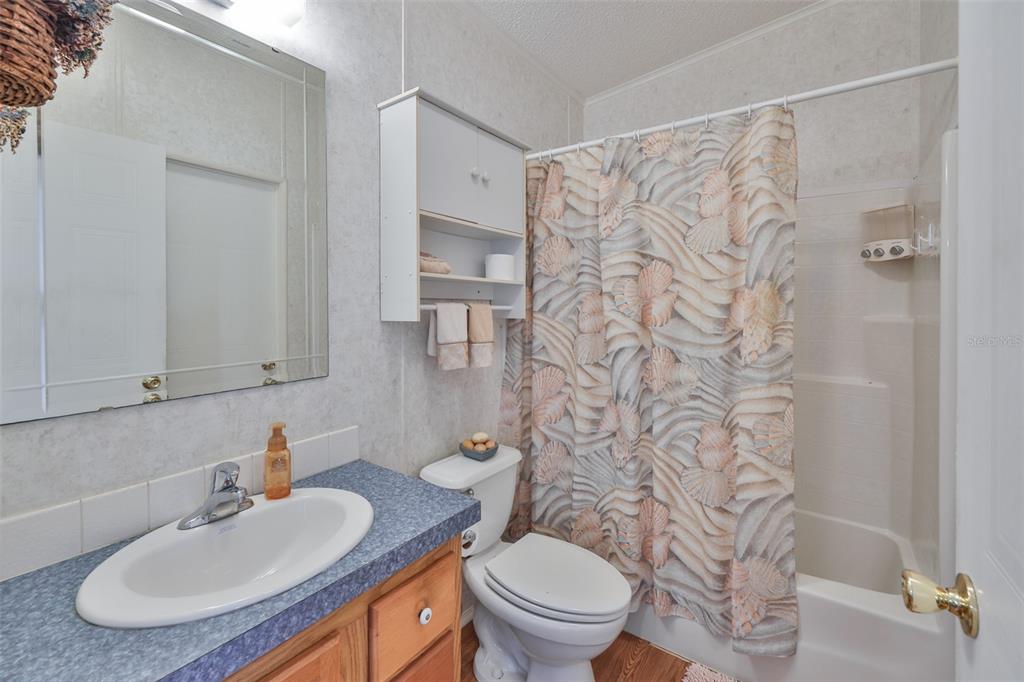 980 7th Street Northwest, Unit 16 Largo, FL 33770 - Photo 25 of 35 a bathroom with a sink toilet and a mirror