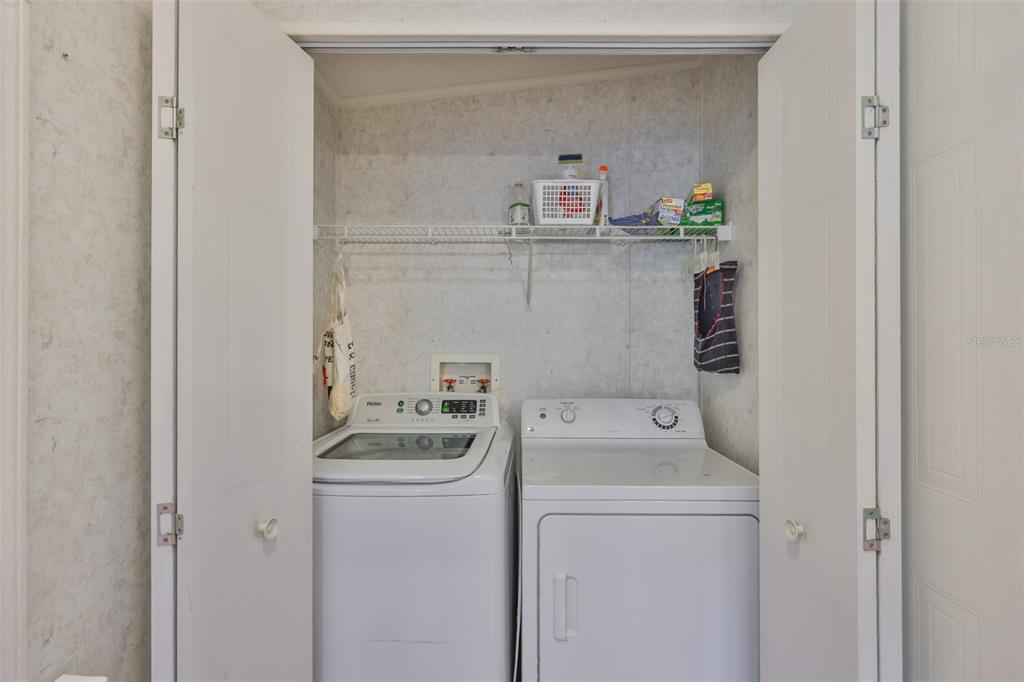 980 7th Street Northwest, Unit 16 Largo, FL 33770 - Photo 26 of 35 a utility room with dryer and washer
