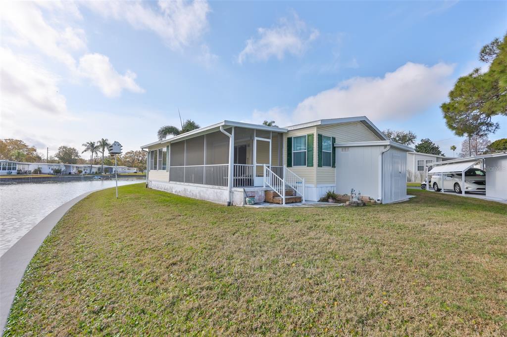 980 7th Street Northwest, Unit 16 Largo, FL 33770 - Photo 27 of 35 a view of a house with a yard