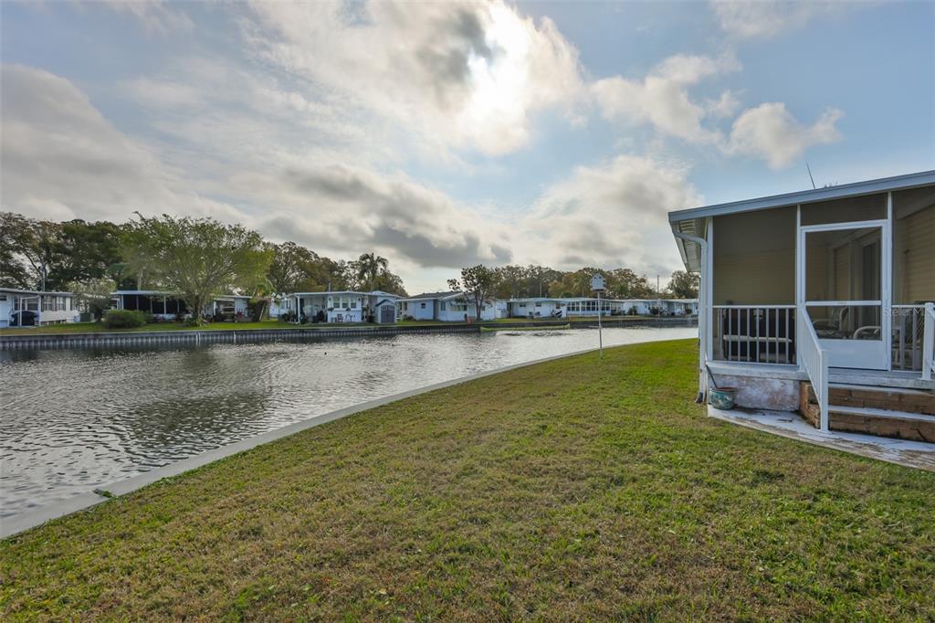 980 7th Street Northwest, Unit 16 Largo, FL 33770 - Photo 28 of 35 a view of a lake with houses in the back