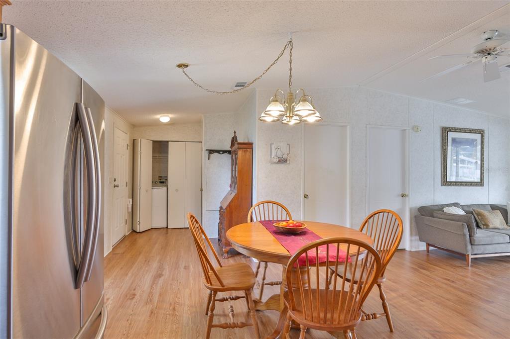 980 7th Street Northwest, Unit 16 Largo, FL 33770 - Photo 6 of 35 a view of a dining room with furniture and chandelier