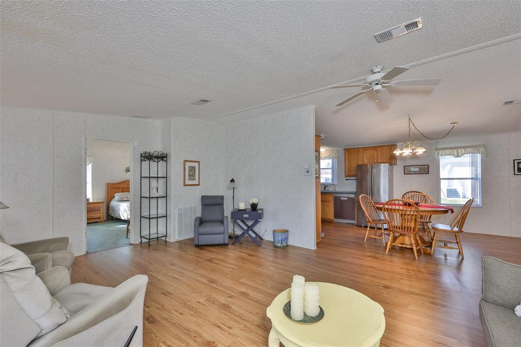 980 7th Street Northwest, Unit 16 Largo, FL 33770 - Photo 10 of 35 a living room with furniture and wooden floor