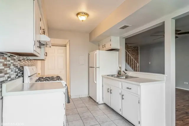 a kitchen with a cabinets and stove