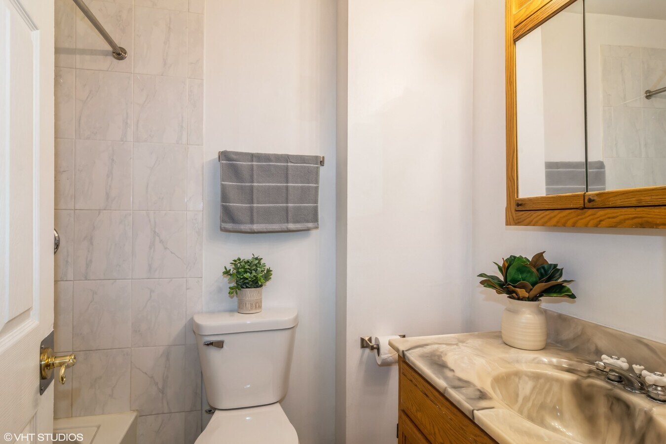 329 David Court, Unit B Bartlett, IL 60103 - Photo 7 of 11 a bathroom with a granite countertop sink a toilet and with mirror