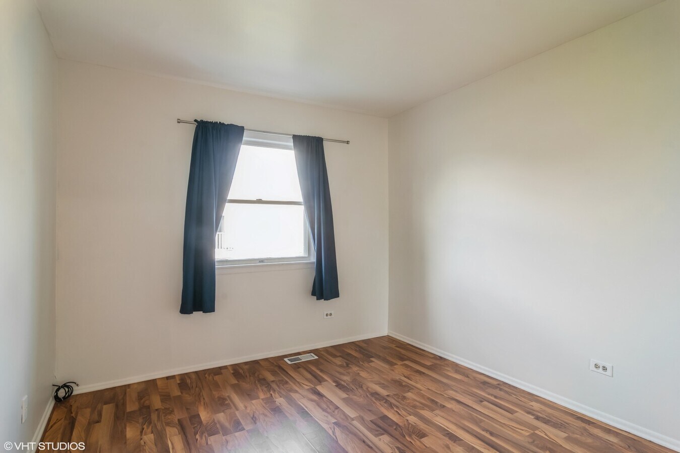329 David Court, Unit B Bartlett, IL 60103 - Photo 9 of 11 an empty room with wooden floor and windows