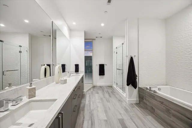 a bedroom with a large bed and a large window