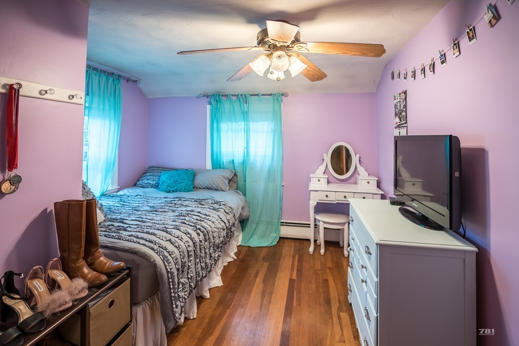12 Surrey Road Salem, MA 01970 - Photo 14 of 15 a bedroom with a bed and a chandelier