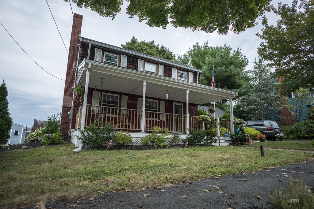 12 Surrey Road Salem, MA 01970 - Photo 2 of 15 a front view of a house with garden