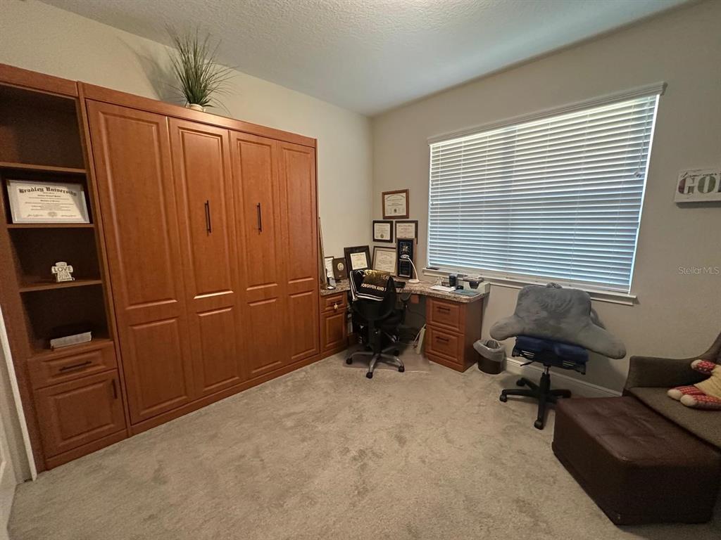 2101 Sunset Wind Loop Oldsmar, FL 34677 - Photo 6 of 13 a room with furniture and a window