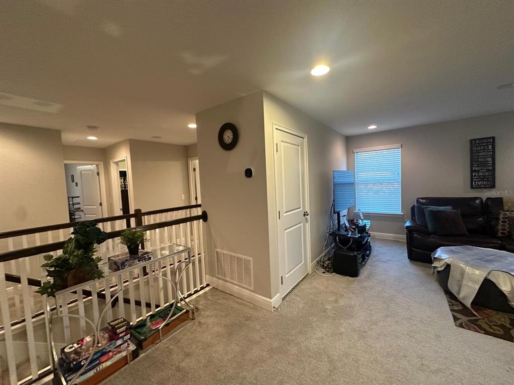 2101 Sunset Wind Loop Oldsmar, FL 34677 - Photo 8 of 13 a view of a livingroom with furniture and a window