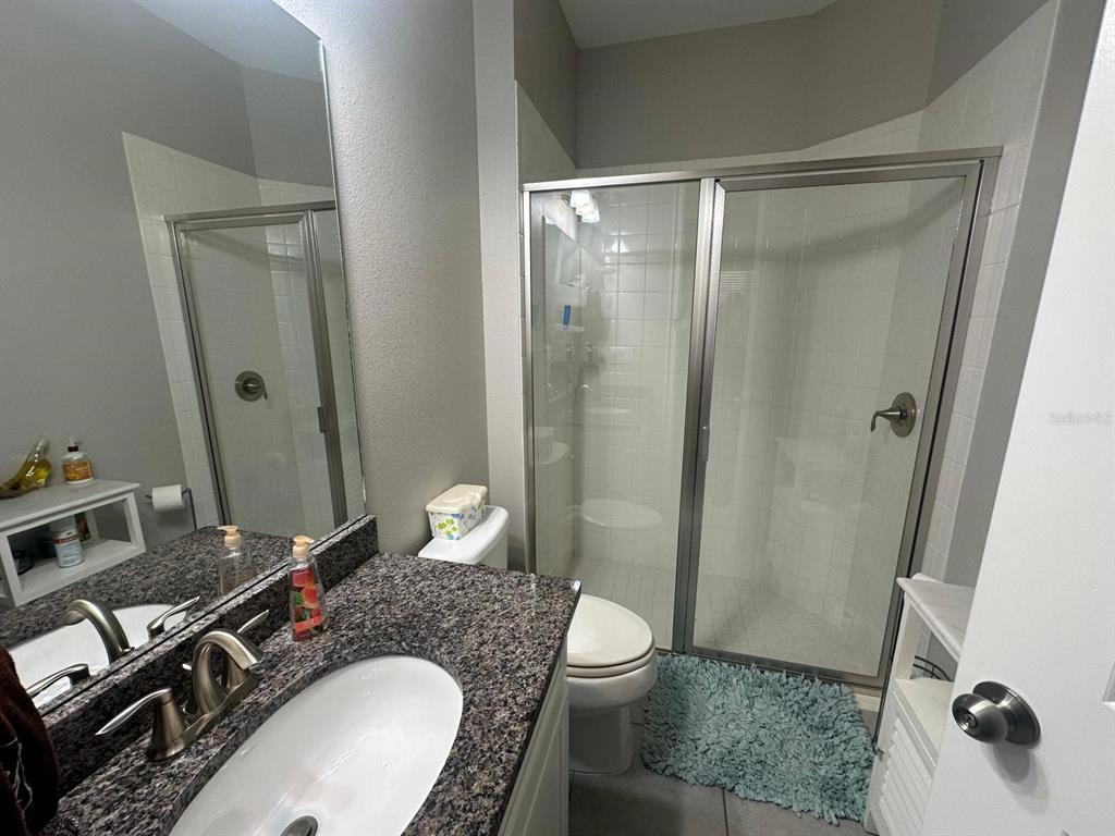 2101 Sunset Wind Loop Oldsmar, FL 34677 - Photo 9 of 13 a bathroom with a sink toilet and shower