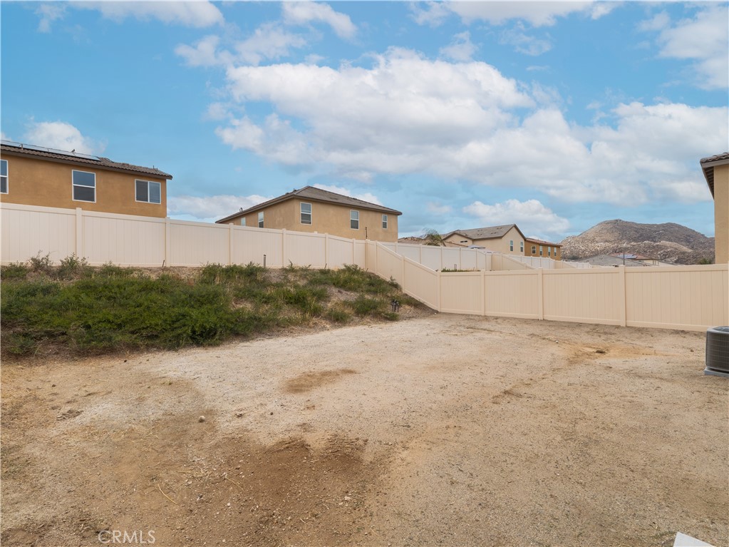 25602 Pne Rdg Road Homeland, CA 92548 - Photo 25 of 35 a view of a grey house with a yard