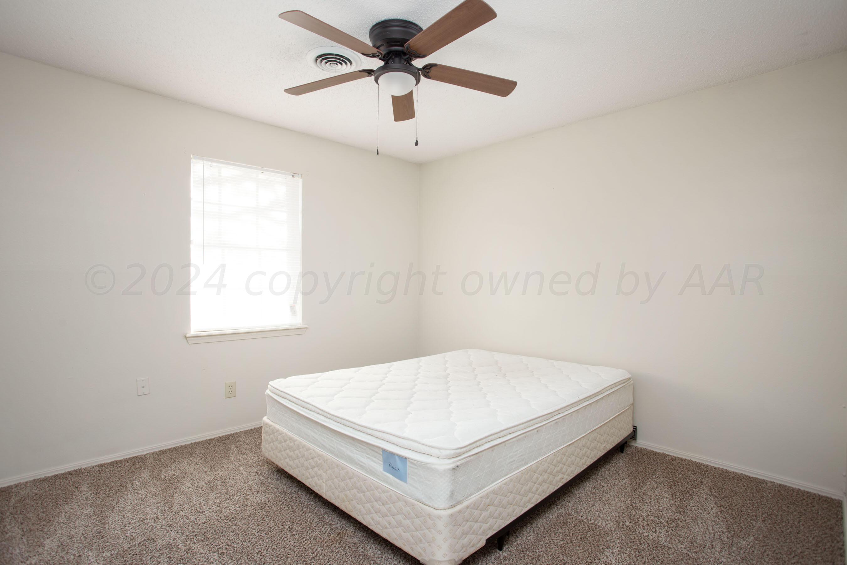 8328 Lamount Drive Amarillo, TX 79110 - Photo 20 of 24 a white bed in a white room