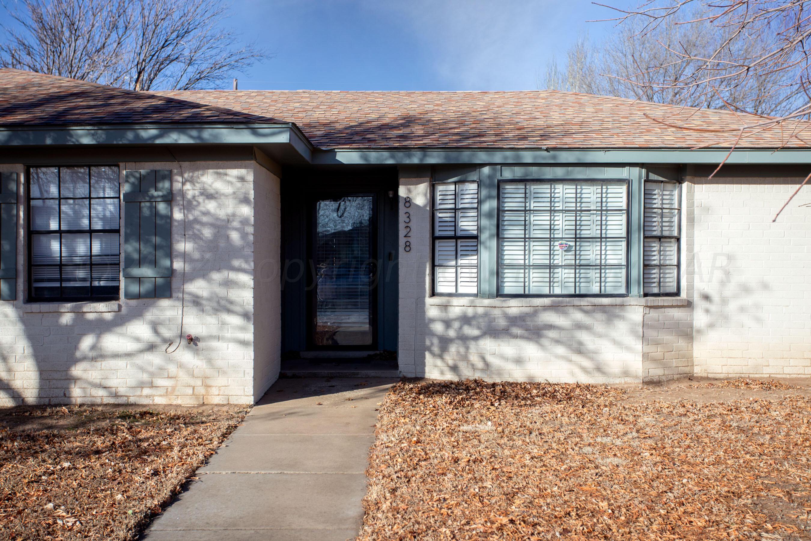 8328 Lamount Drive Amarillo, TX 79110 - Photo 2 of 24 a front view of a house