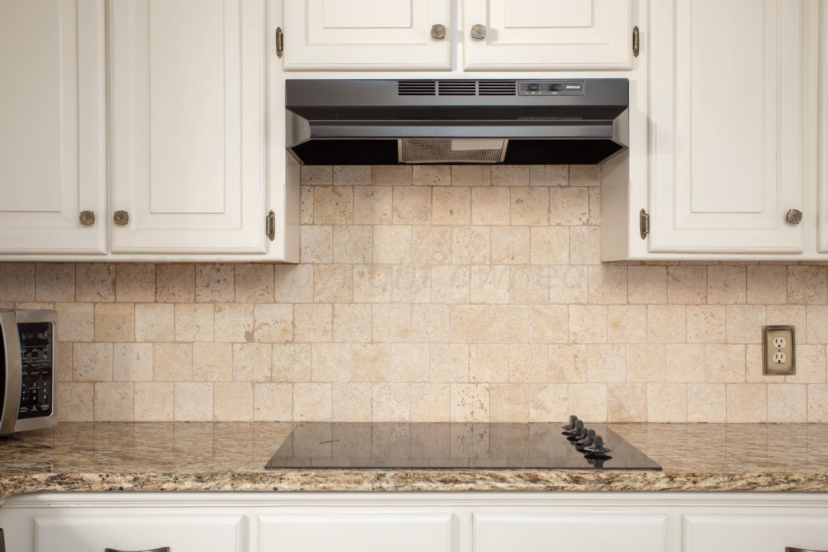 8328 Lamount Drive Amarillo, TX 79110 - Photo 5 of 24 a view of a kitchen counter top and stove