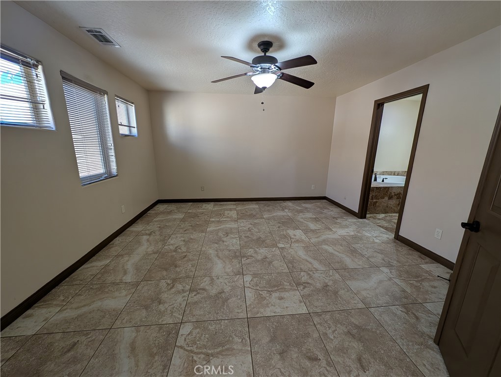 27160 Vista Road, Unit 21 Helendale, CA 92342 - Photo 4 of 11 a view of an empty room with a window