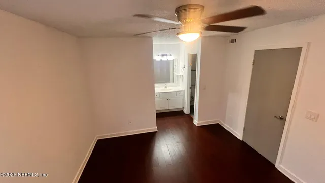 an empty room with wooden floor