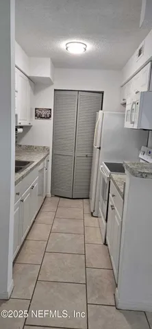 a bathroom with a toilet a sink and bathtub