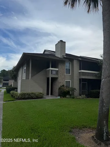 a swimming pool with trees in the background