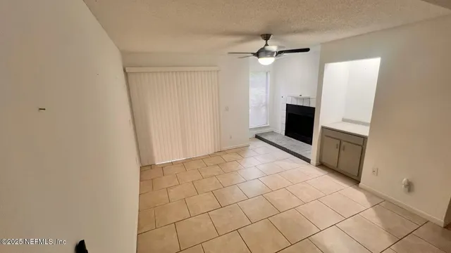 a view of a livingroom with a kitchen