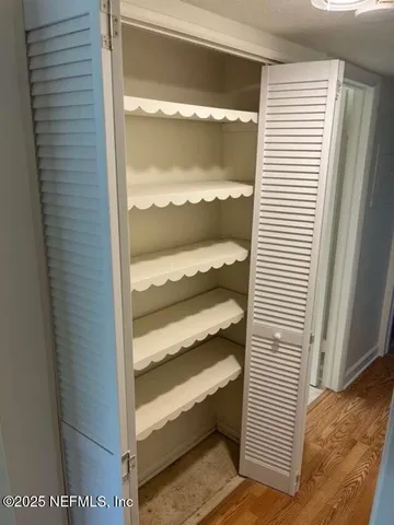 a view of a bedroom with a door