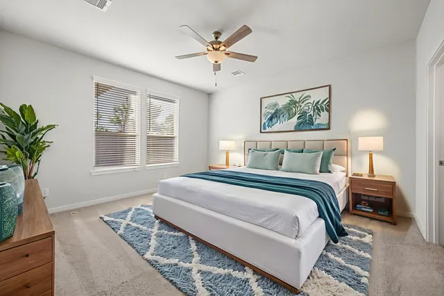 a bedroom with bed and furniture