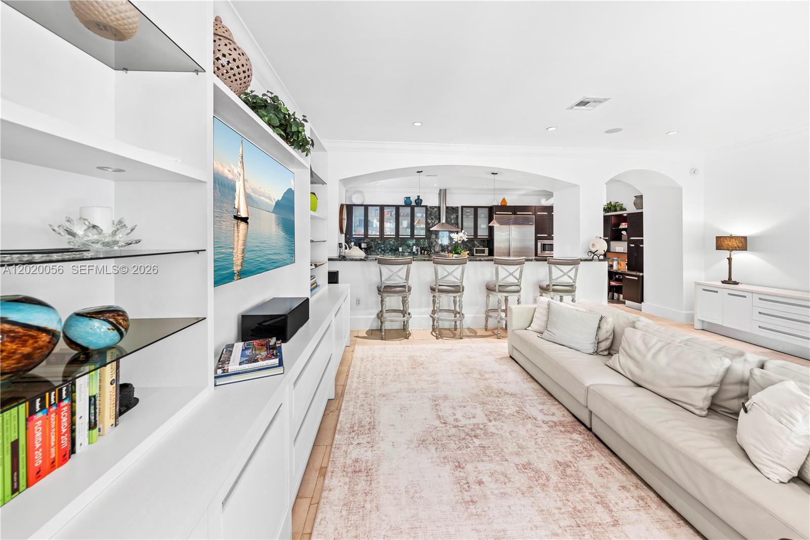 4196 Douglas Road Miami, FL 33133 - Photo 38 of 96 a living room with furniture and a flat screen tv