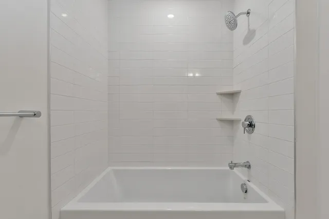 a close up of a bathtub curtain