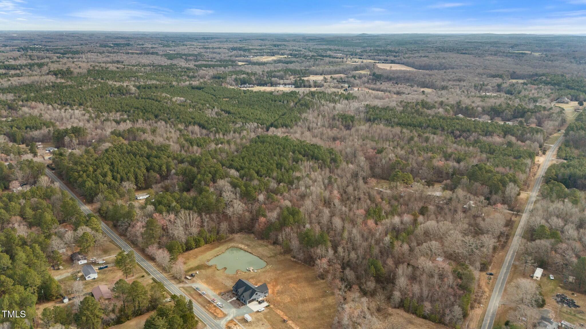 6621 Nicks Road Mebane, NC 27302 - Photo 6 of 10 a view of a field with an ocean