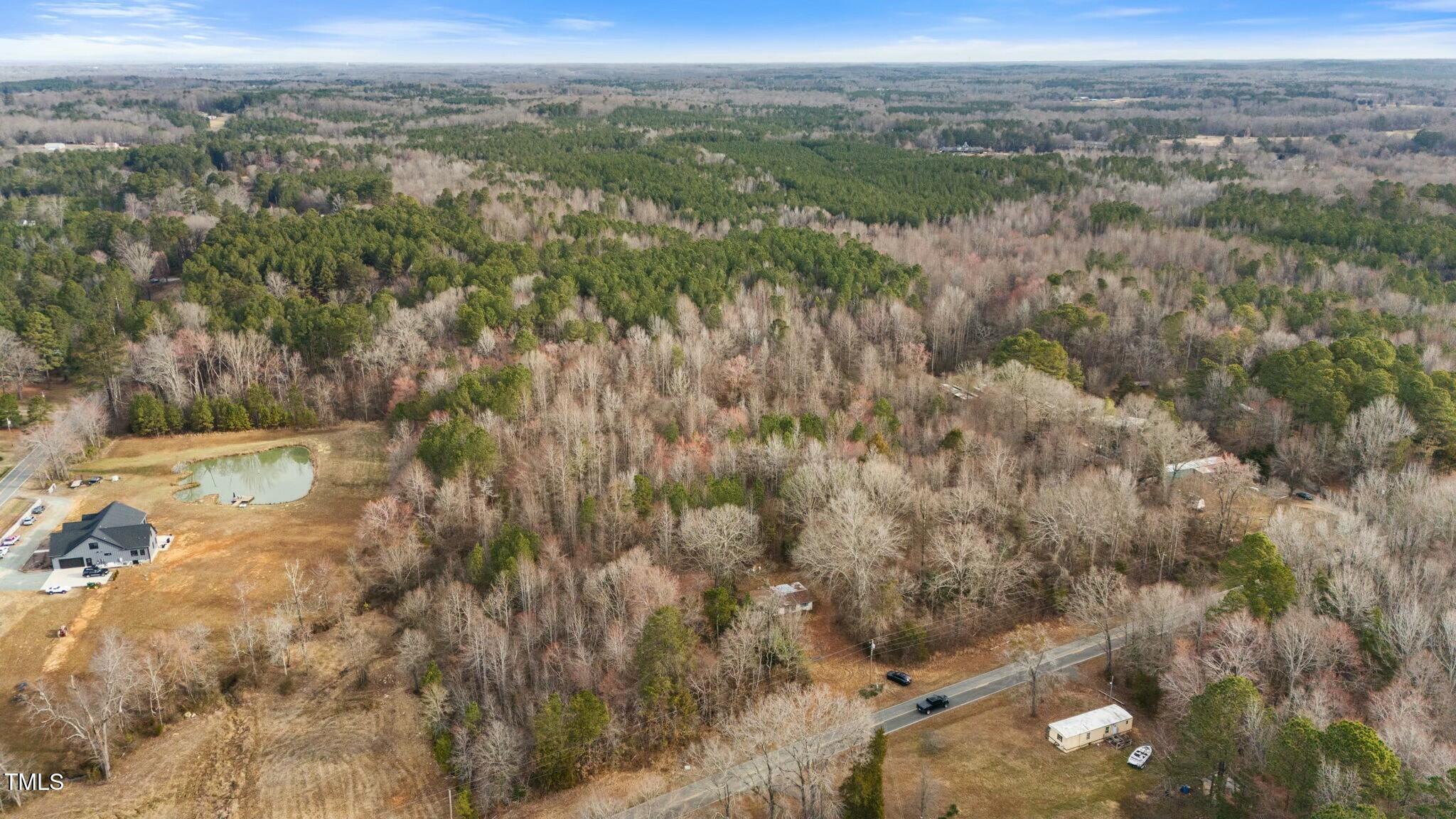6621 Nicks Road Mebane, NC 27302 - Photo 7 of 10 a view of a yard with a mountain