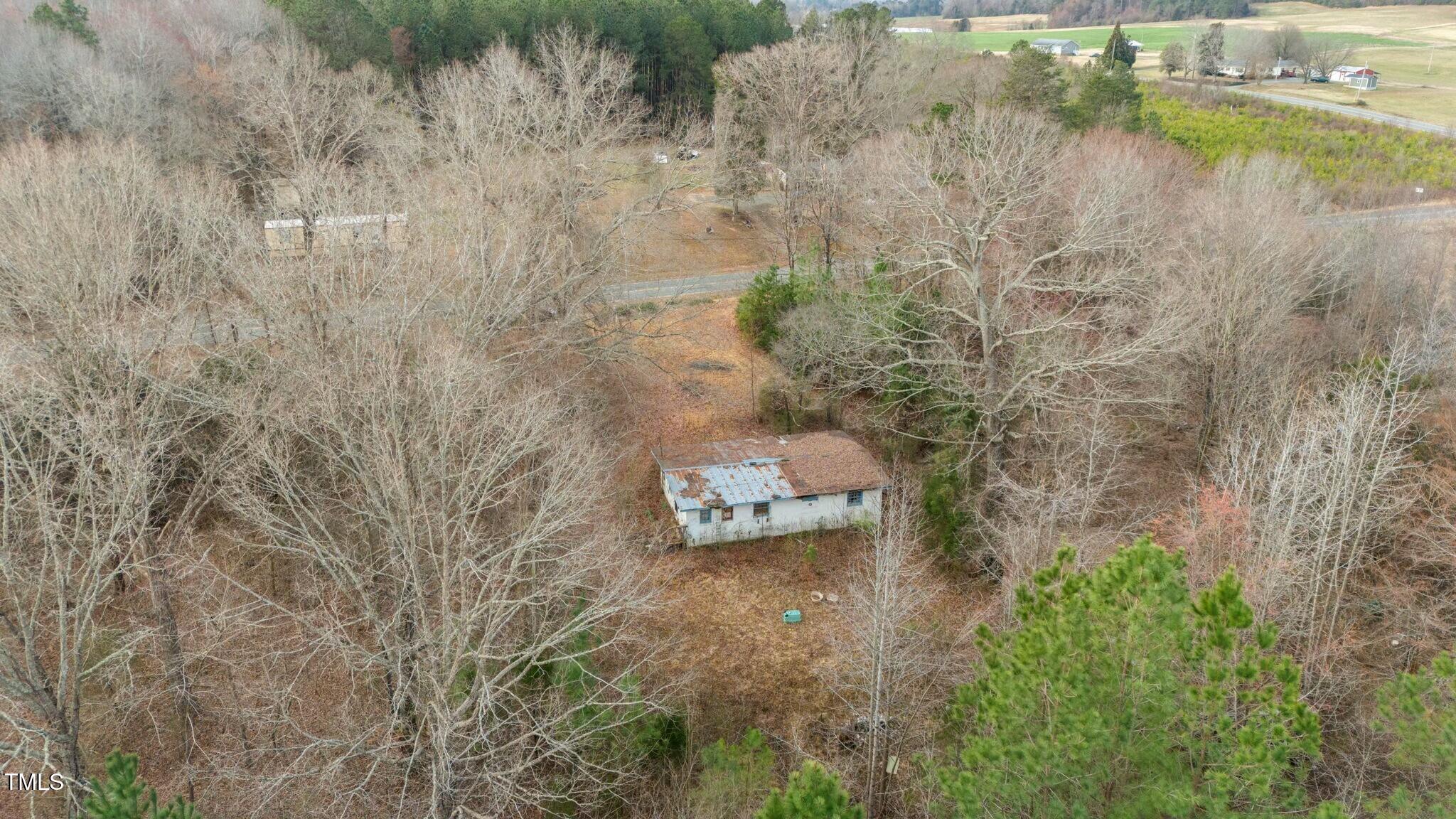 6621 Nicks Road Mebane, NC 27302 - Photo 9 of 10 a view of a lake with outdoor space and trees all around
