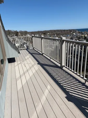 a view of balcony with wooden floor