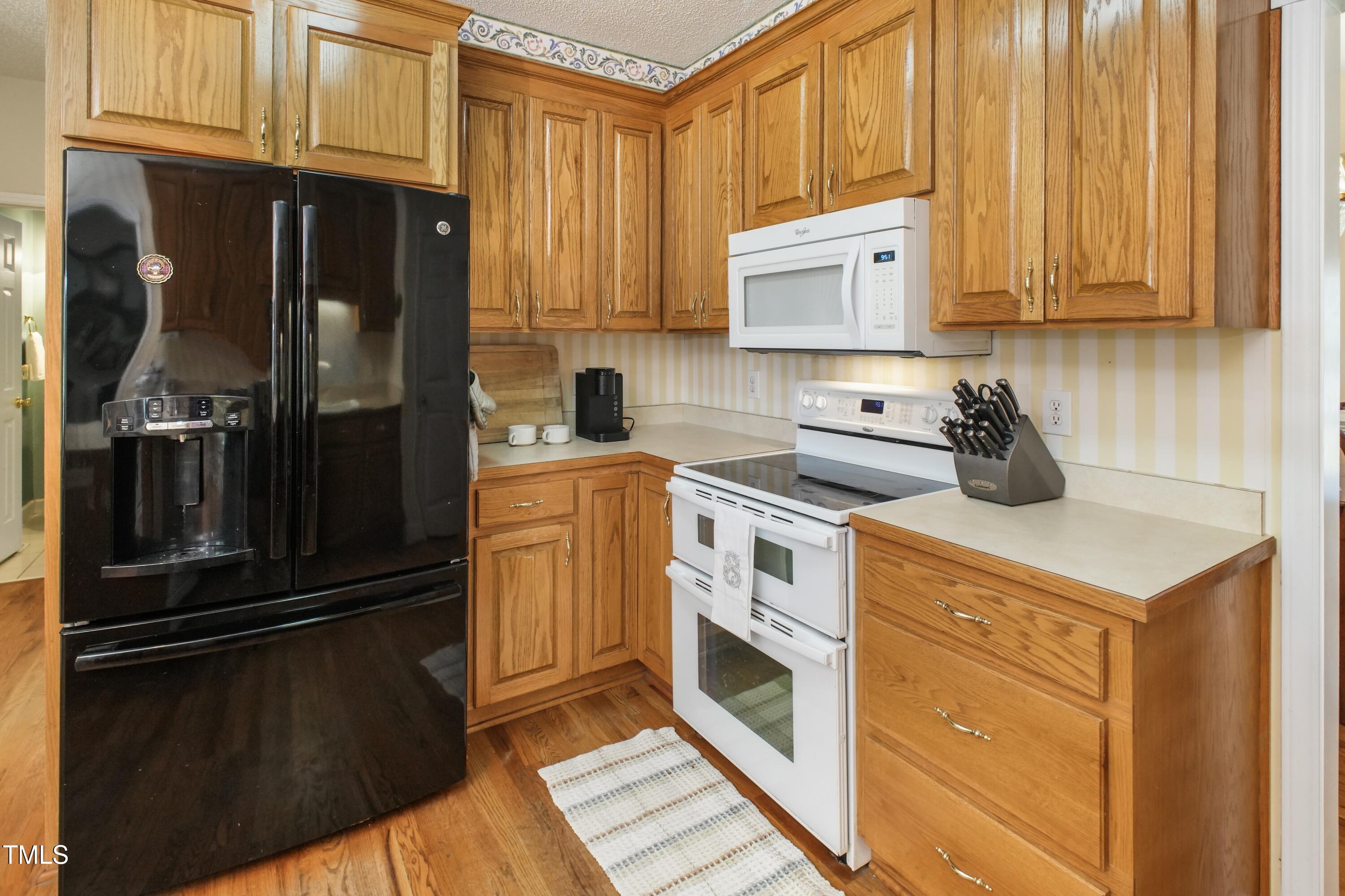 115 Hunters Walk Lane Clinton, NC 28328 - Photo 12 of 39 a kitchen with a refrigerator stove and sink