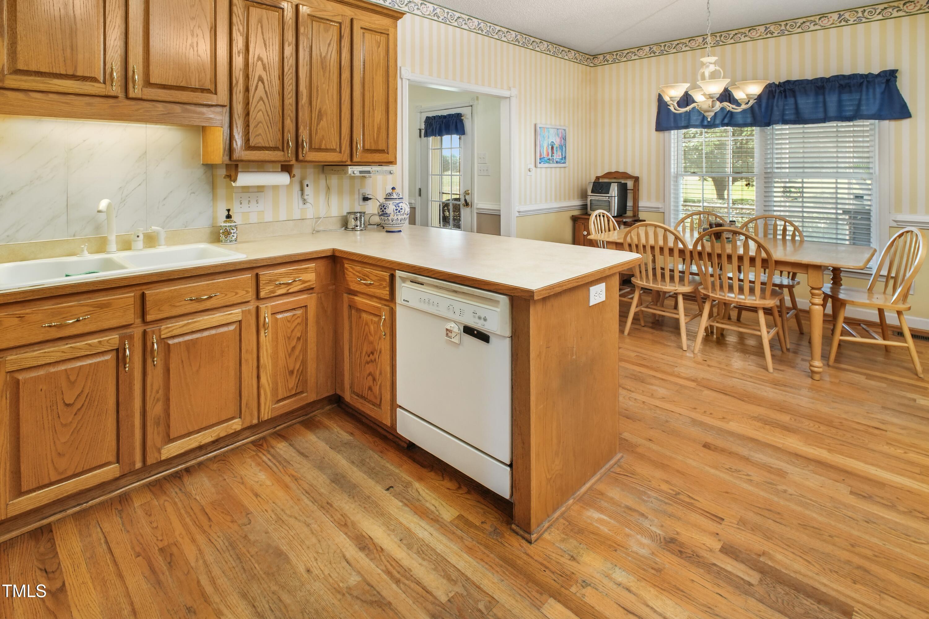 115 Hunters Walk Lane Clinton, NC 28328 - Photo 13 of 39 a kitchen with stainless steel appliances a sink and cabinets