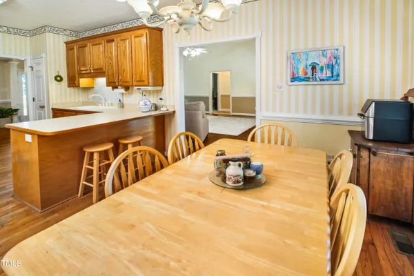 a bedroom with a bed and a table