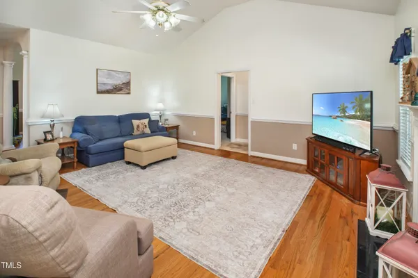 a living room with furniture and a flat screen tv