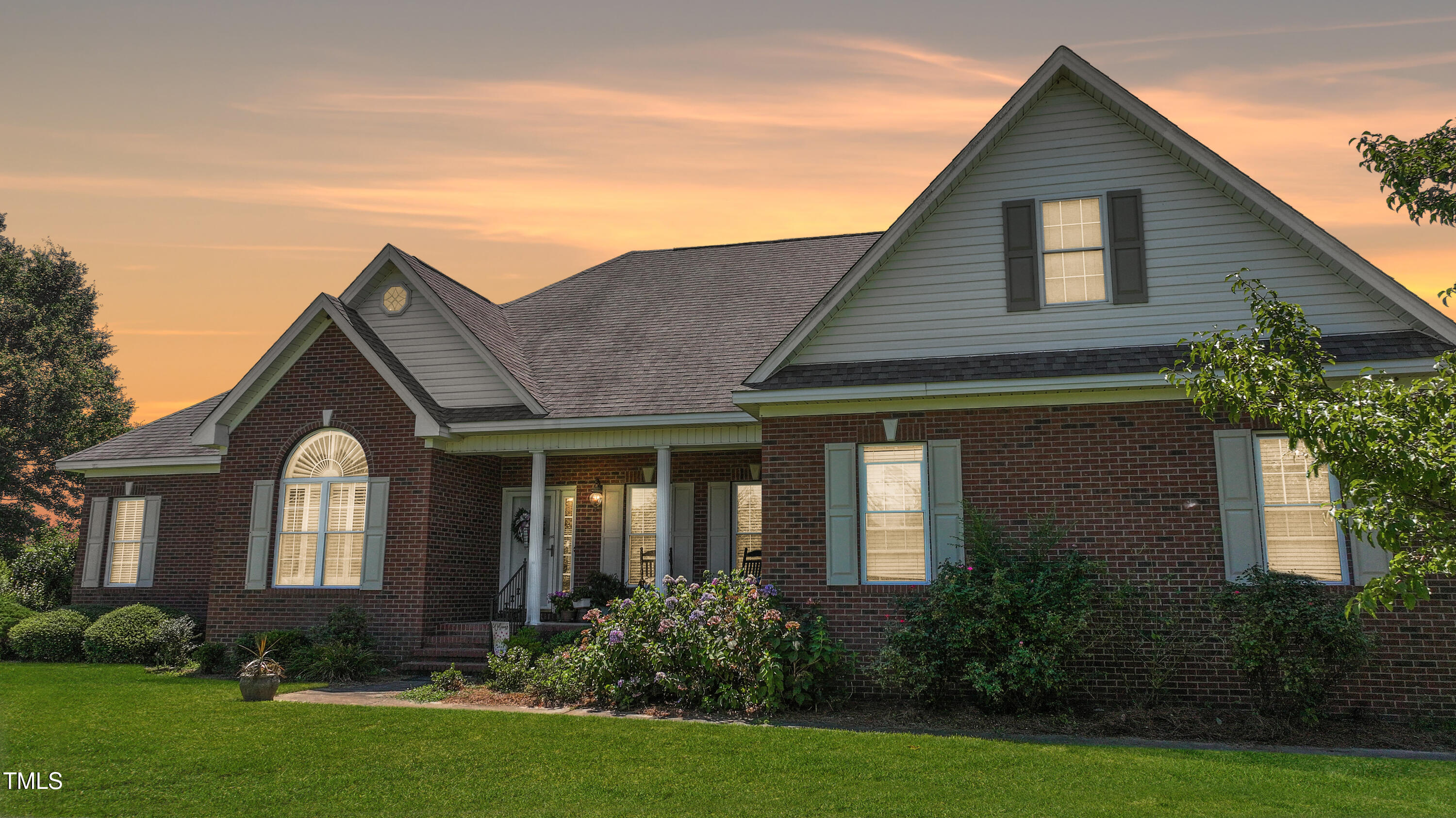 115 Hunters Walk Lane Clinton, NC 28328 - Photo 2 of 39 a front view of a house with garden